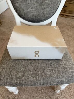 On Running Metallic Gold and White Logo Storage Box